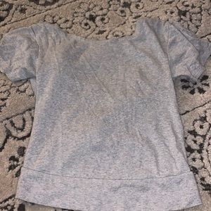 gray short sleeve top with cross in the back